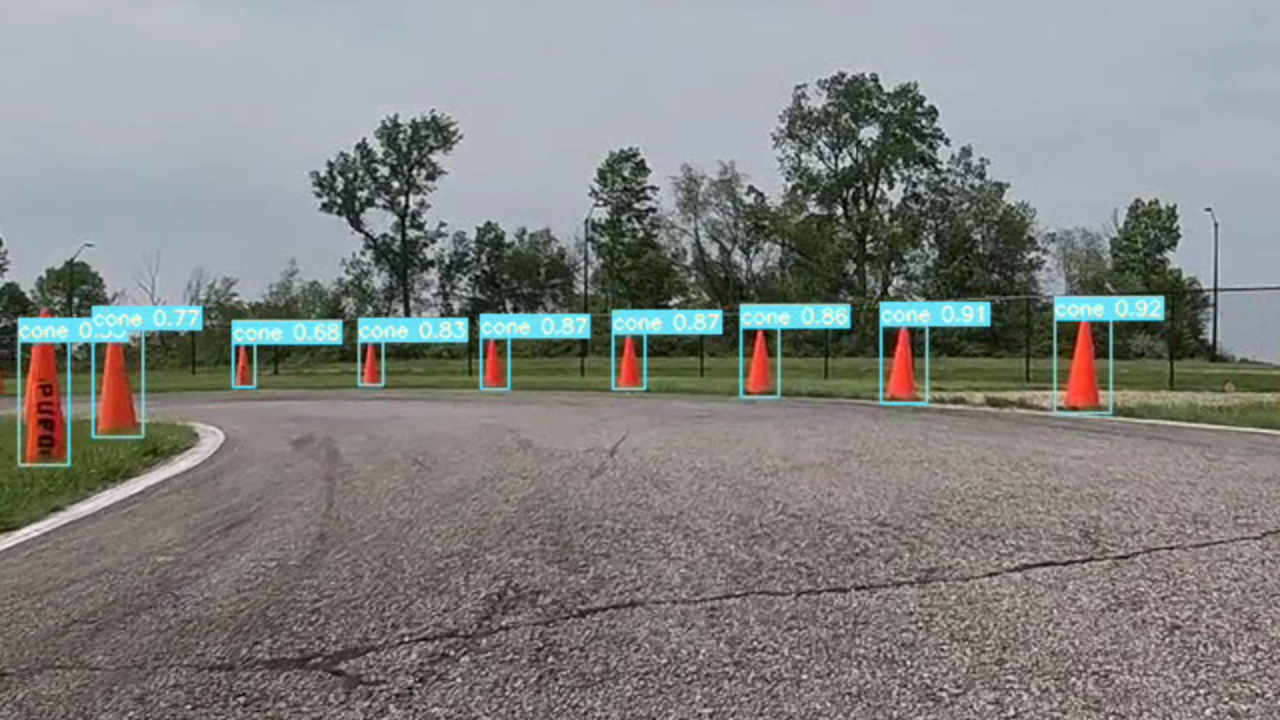 A screenshot of Coneslayer neural net inference on traffic cones next to a racetrack